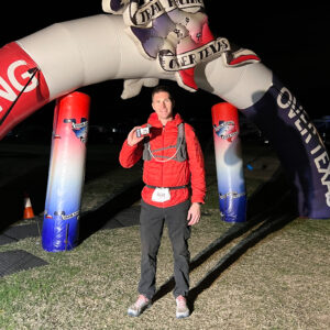 Man at finish line of ultra endurance race